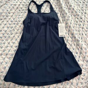 Never worn, new with tags. Super cute navy lululemon tennis dress.